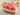 Raw boneless pork on a wooden cutting board